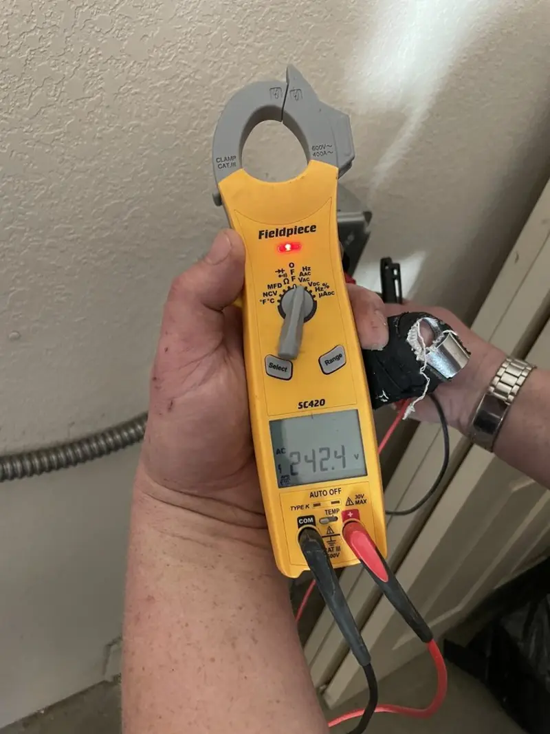 Voltage testing with clamp meter during Generator Installation in Homestead